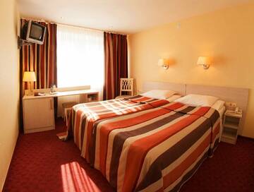 Номер стандарт с 2 односпальными кроватями в Гостинице Тагил